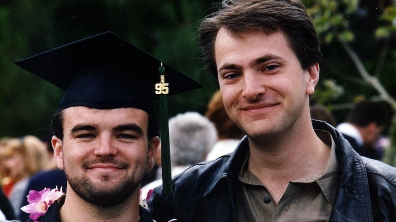 men smiling at school graduation