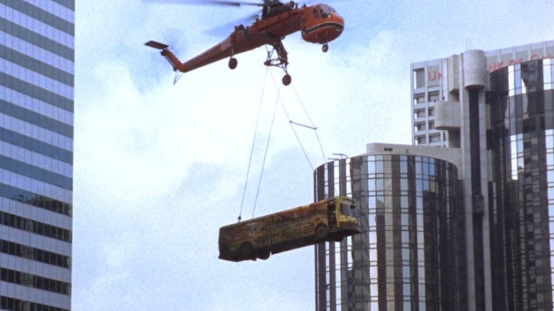 helicopter carrying school bus