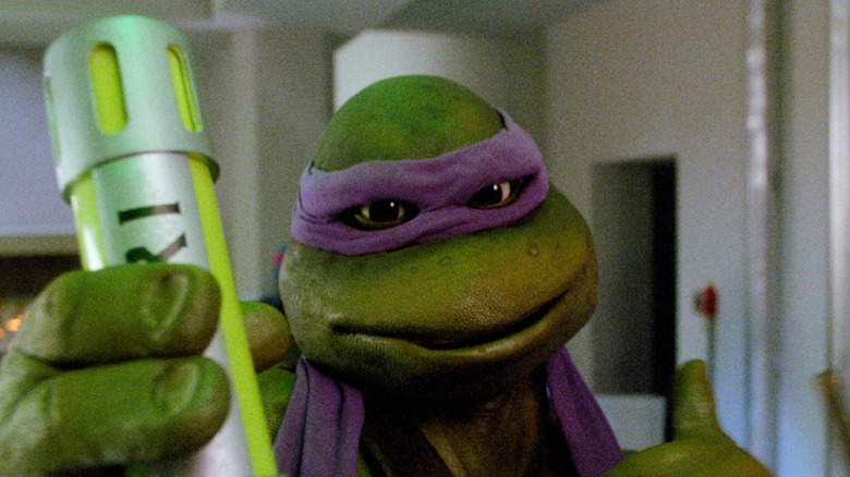 Donatello holding up a vile of Ooze giving a thumbs up in Teenage Mutant Ninja Turtles II: The Secret of the Ooze
