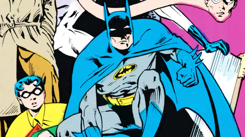 Batman crouches alongside Robin in a panel from Detective Comics #572