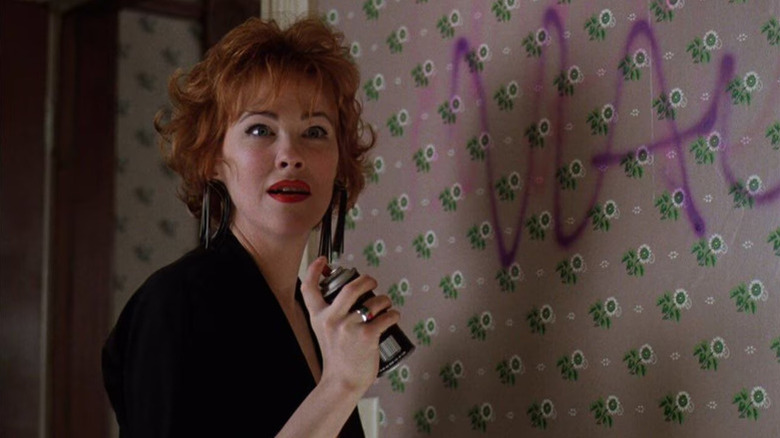 Delia Deetz spray painting a wall in Beetlejuice