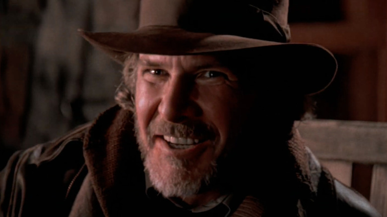 Harrison Ford as Indiana Jones grinning in Young Indiana Jones and the Mystery of the Blues