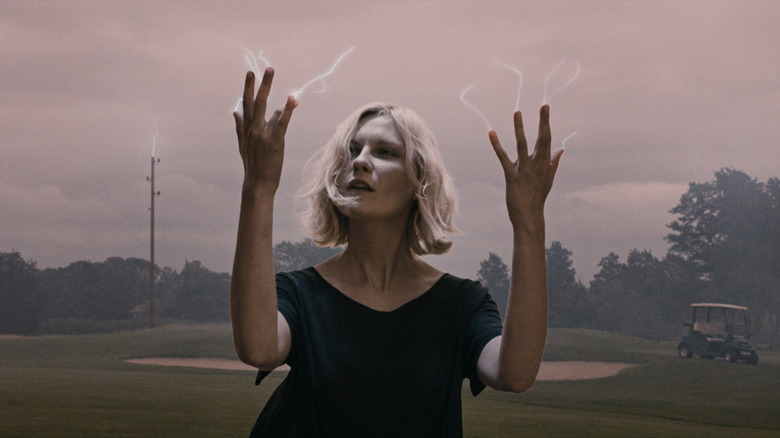 Sparks flying from Justine's fingers in Melancholia