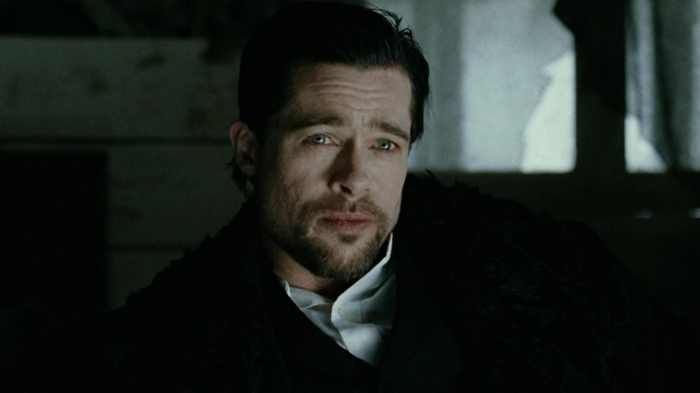 Brad Pitt's Jesse James looks across frame in The Assassination of Jesse James by the Coward Robert Ford