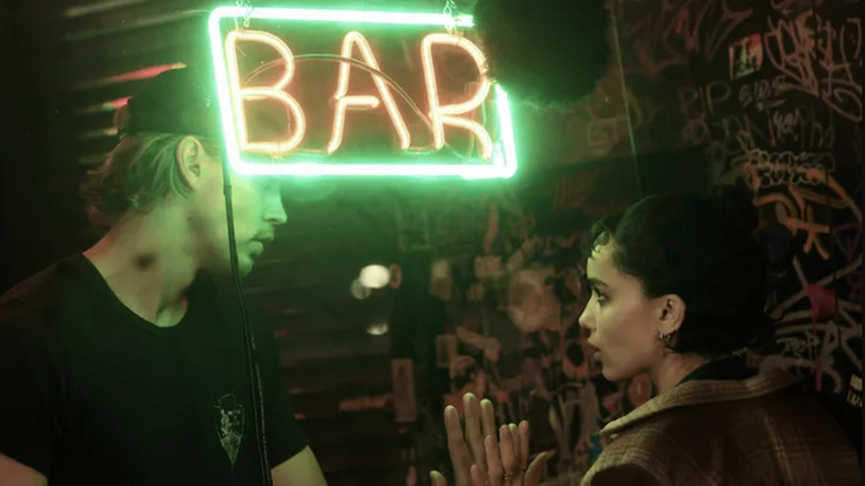 Hank and Yvonne share a moment through the window of Paul's Bar in Caught Stealing