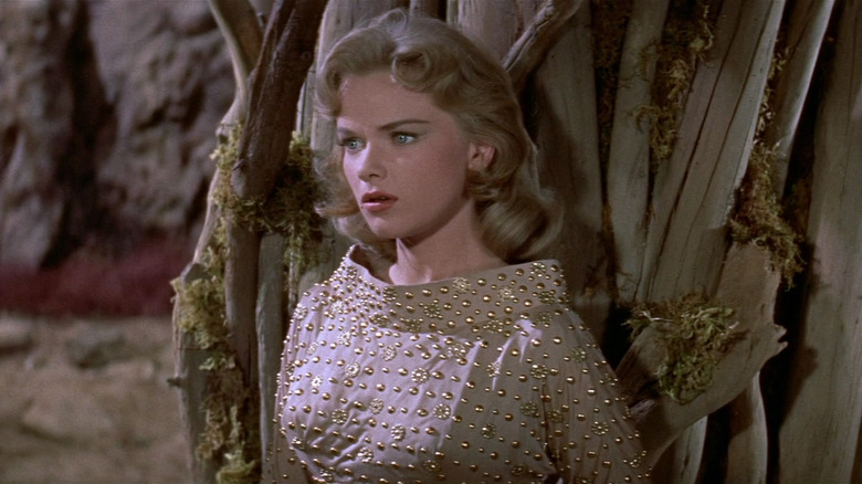 Alta against a tree in Forbidden Planet