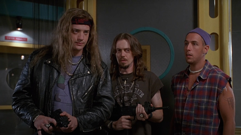 Chazz, Rex, and Pip holding guns in Airheads