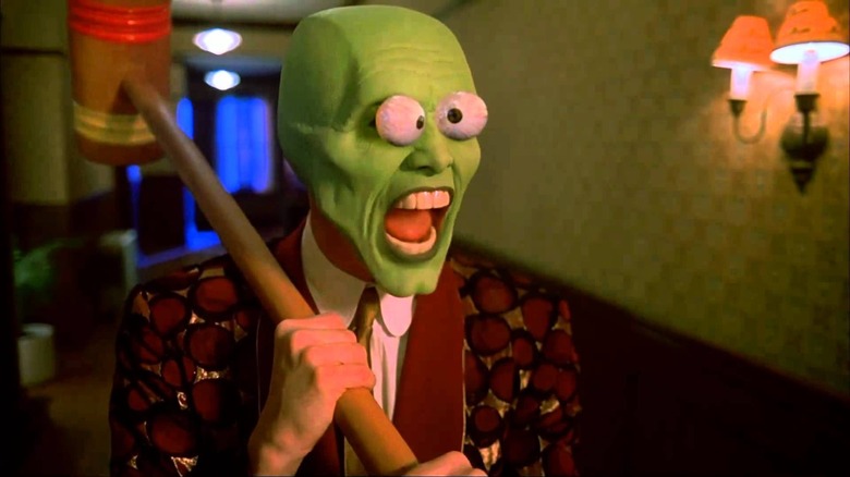 Stanley Ipkiss, possessed by the Mask, bugging his eyes out and wielding a mallet.