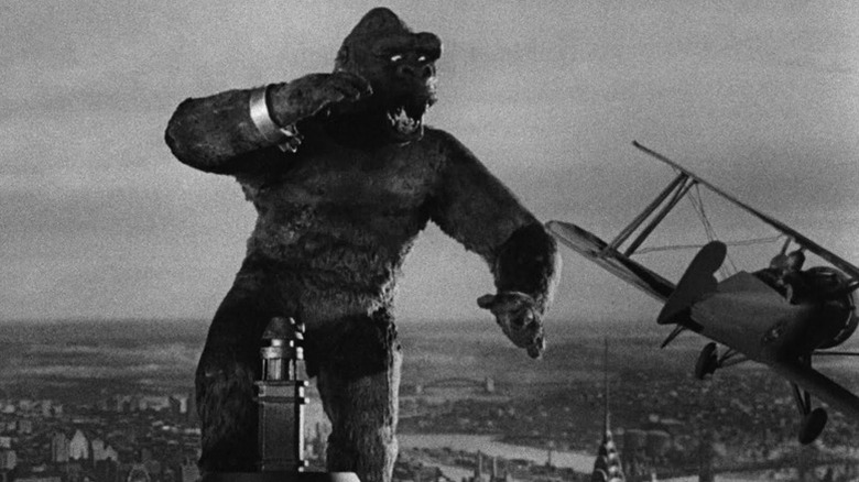 Kong standing on top of a skyscraper in "King Kong"