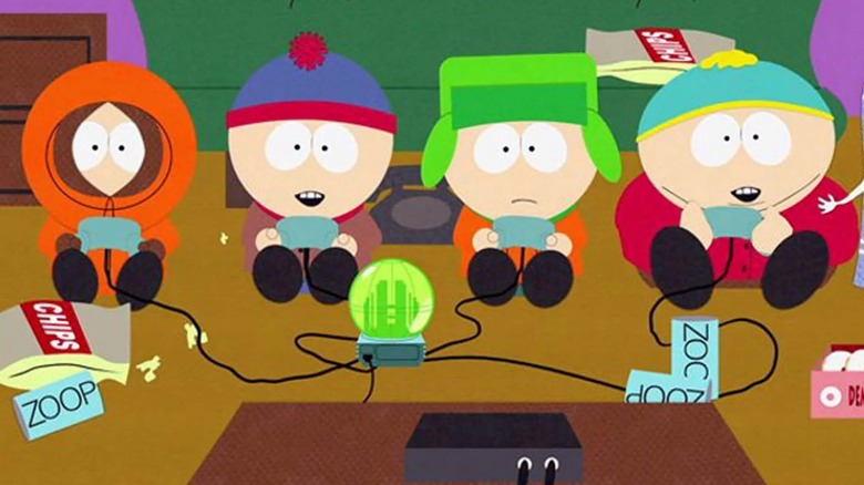 south park characters kenny, stan, kyle, and cartman sitting in front of a tv playing video games