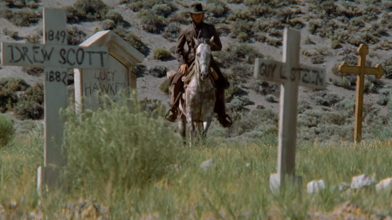The Stranger riding through a graveyard in High Plains Drifter