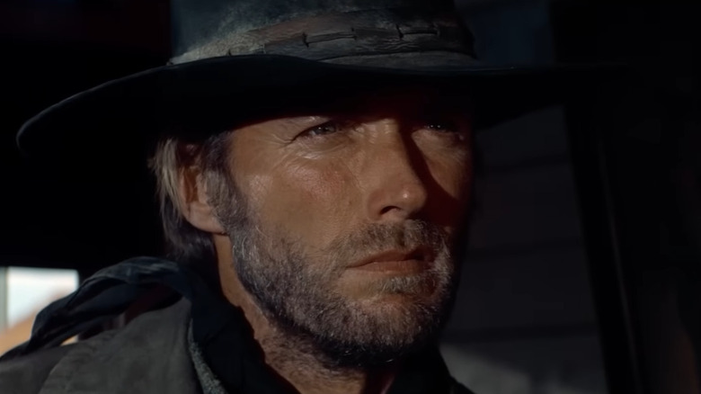 The Stranger looking at the bartender in High Plains Drifter