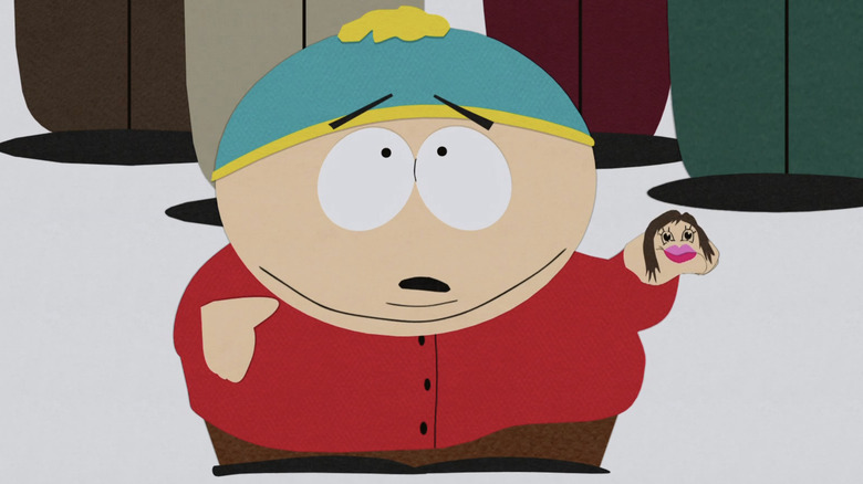 Cartman (Trey Parker) mocks Jennifer Lopez with a hand puppet on South Park