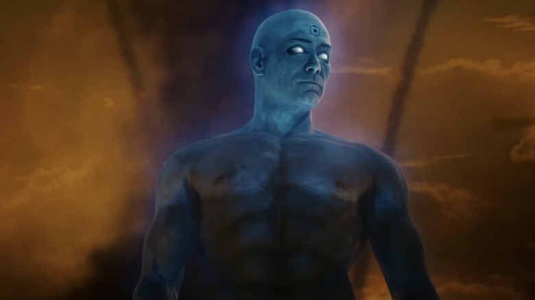Billy Crudup's Jon Osterman / Doctor Manhattan is seen against an orange sky in Watchmen