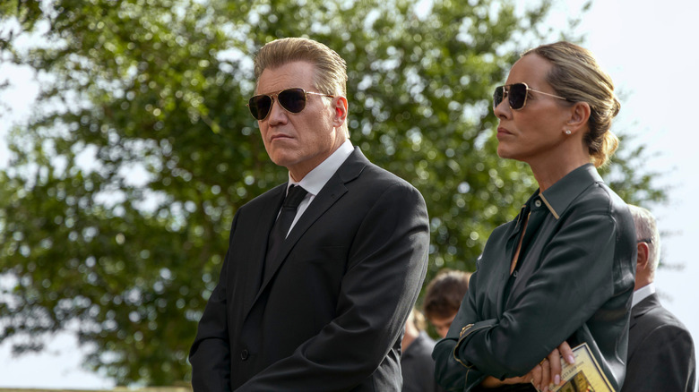 Harlan Buckley and Belle wearing sunglasses at a funeral in The Waterfront