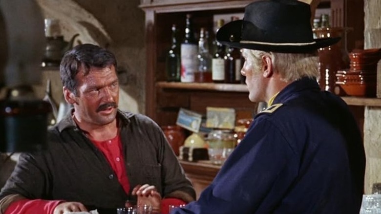 A sweaty guy in a bar talking to a Union soldier in The Return of Ringo
