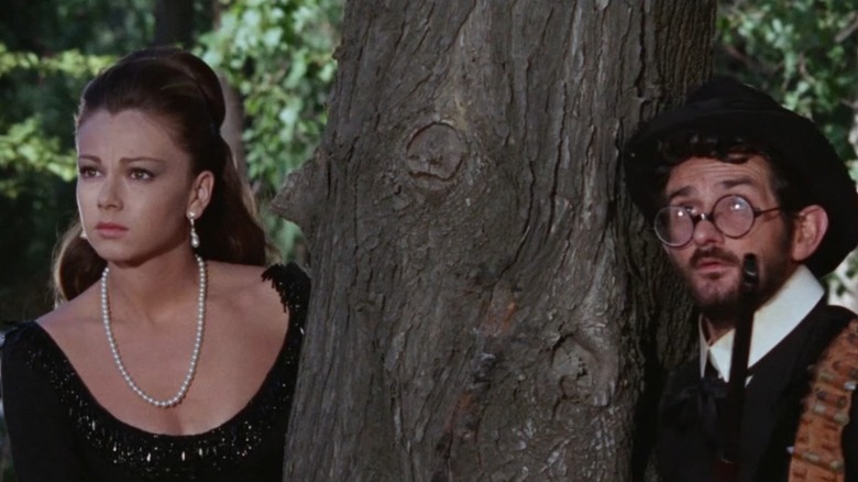 A pretty woman and a nerdy guy by a tree in The Return of Ringo