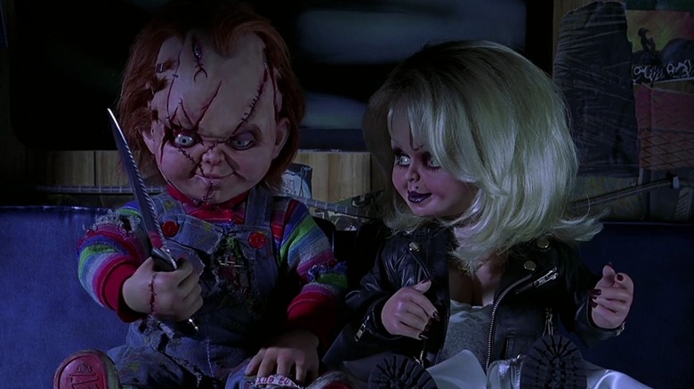 Chucky with a knife next to Tiffany in Bride of Chucky