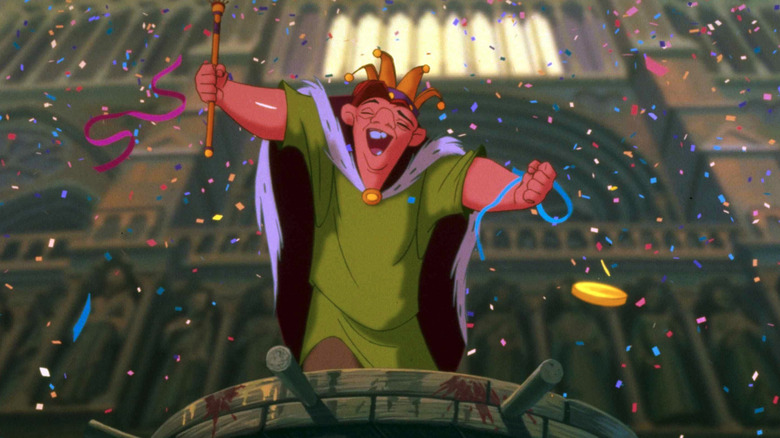 Quasimodo celebrates with a crown and staff in The Hunchback of Notre Dame