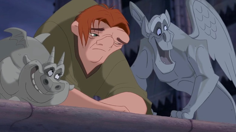 The Hunchback of Notre Dame - Quasimodo looking sad as gargoyles Victor and Hugo try to cheer him up