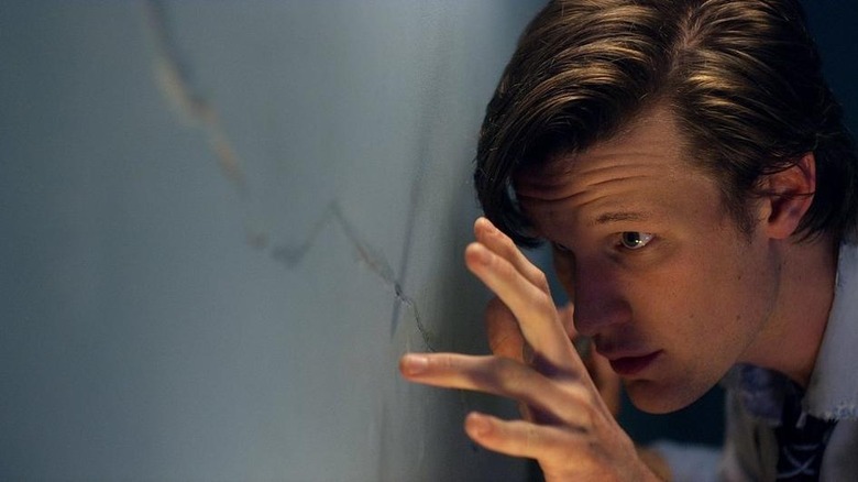 Doctor touching a crack
