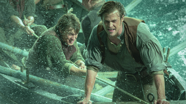 Chris Hemsworth as Owen Chase holds on during a storm during In the Heart of the Sea