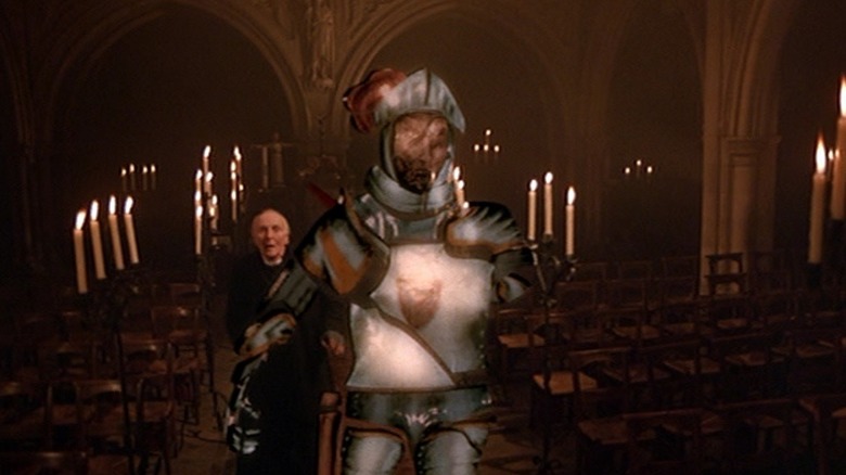Reverend Duncan Nesbitt is menaced by the Knight in Young Sherlock Holmes