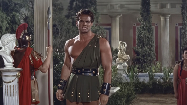 Steve Reeves' Glaucus stands in a palace in The Last Days of Pompeii