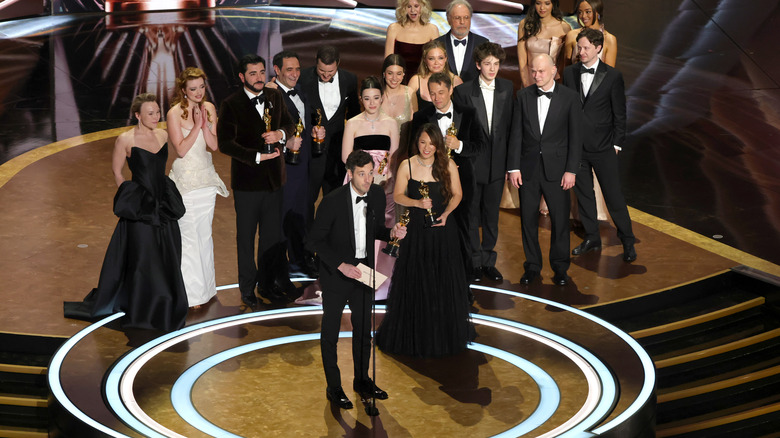 The cast and crew of Anora on the Oscars stage, accepting Best Picture