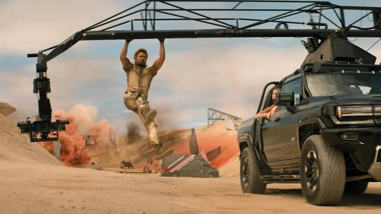 Ryan Gosling (or his stuntman) hanging on a crane mounted to a truck in The Fall Guy