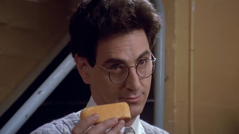 Harold Ramis's Egon Spengler holds a Twinkie in Ghostbusters