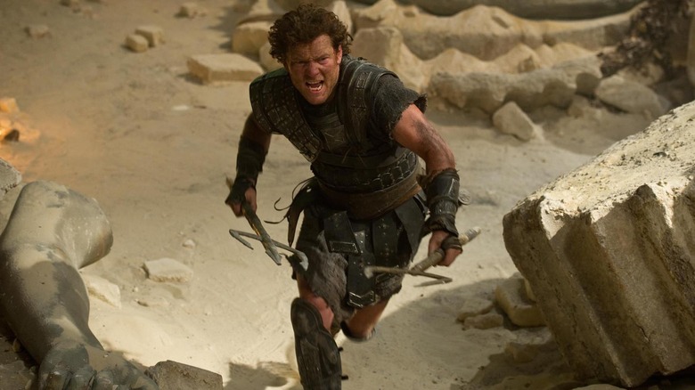 Perseus, holding two tridents, charging at someone in Wrath of the Titans.