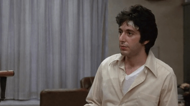 Sonny with a bandage on his head in Dog Day Afternoon
