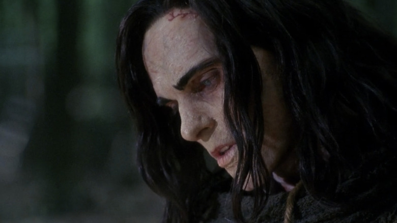 Luke Goss as the Frankenstein Monster looking downward in Frankenstein (2004)