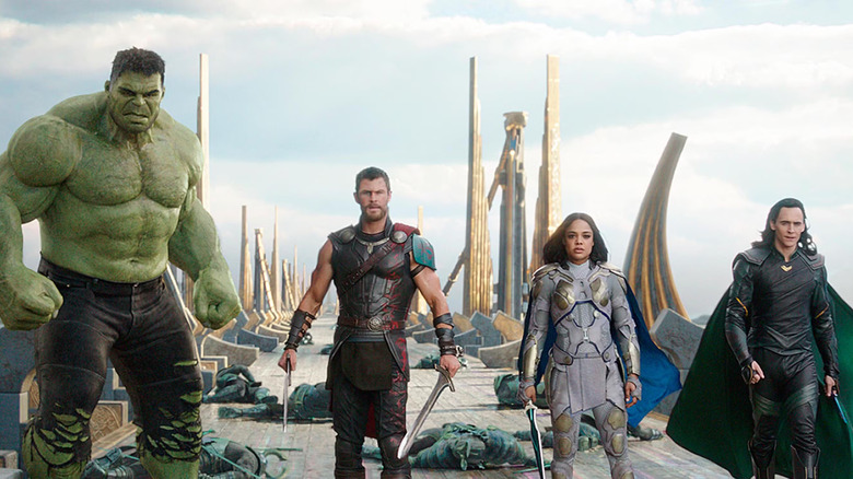 The Hulk, Thor, Valkyire, and Loki standing on a bridge in Thor: Ragnarok