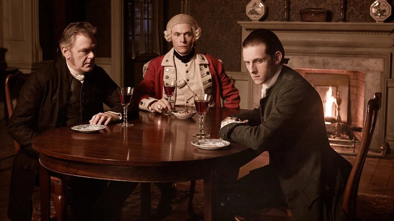 Woodull and two friends at a table in Tun: Washington's Spies