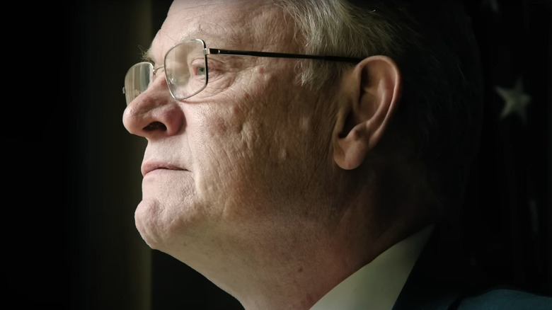 Jared Harris as Defense Secretary Red Baker looks solemnly out the window in the movie 