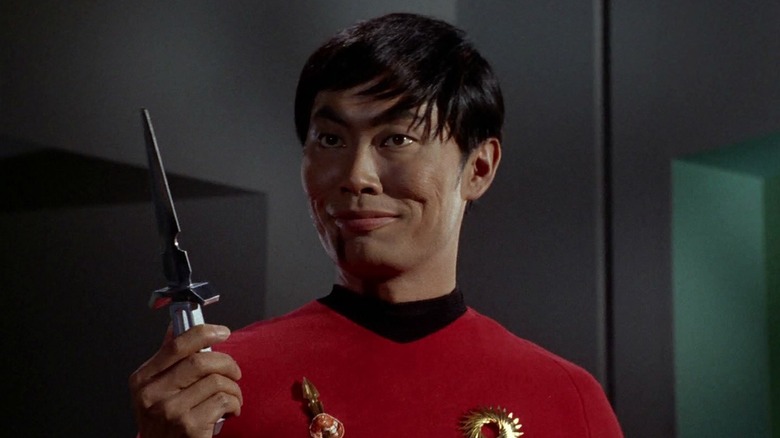 George Takei holds a knife as an evil Hikaru Sulu in Star Trek