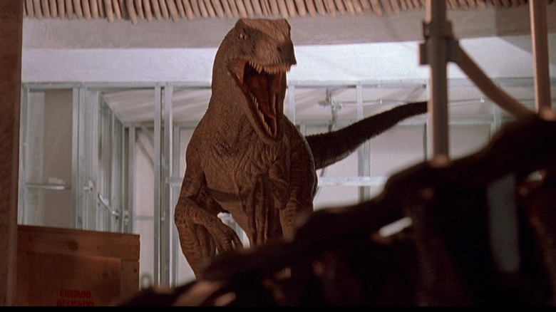 A bird of prey opens its jaws as it enters the Jurassic Park Visitor Center in Jurassic Park