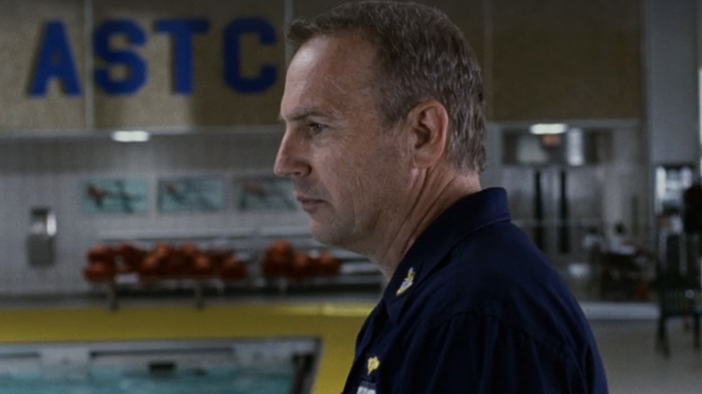 Kevin Costner's surveys a swimming pool in The Guardian