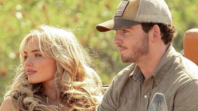 Oreana (Natalie Alyn Lind) and Carter (Finn Little) sitting in a truck on "Dutton Ranch."