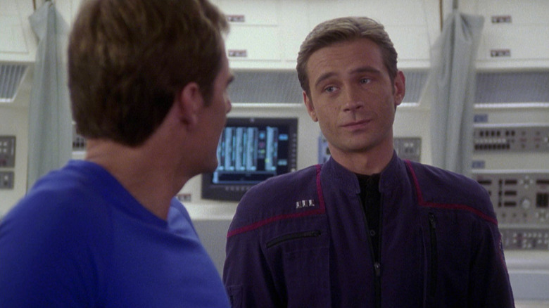 Trip looking at Captain Archer in sickbay on Star Trek: Enterprise