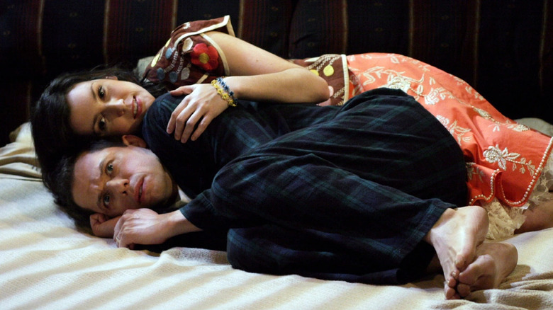 Jon Cryer as Alan and Melanie Lynskey as Rose on Two and a Half Men