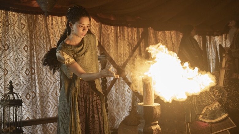 Tanselle using a trick to produce a flame to amuse Dunk and Egg in A Knight of the Seven Kingdoms