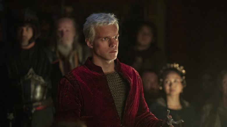 Aerion in a red jacket and looking angry in The Knight of the Seven Kingdoms