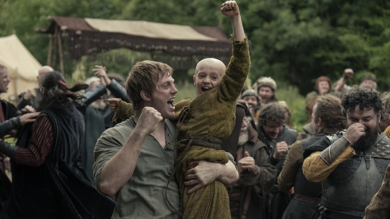 Peter Claffey's Dunk lifting Dexter Sol Ansell's Egg in the air as a crowd celebrates around them in A Knight of the Seven Kingdoms