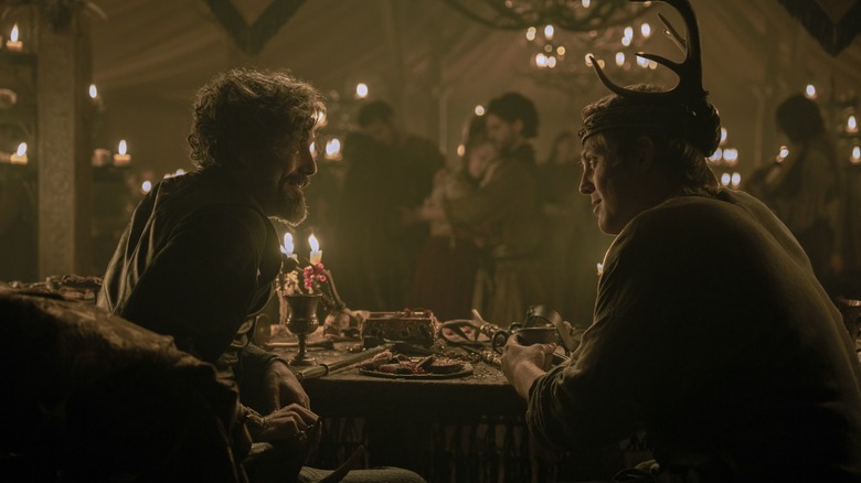 Daniel Ings as Lyonel Baratheon talking to Peter Claffey's Dunk at a banquet in A Knight of the Seven Kingdoms