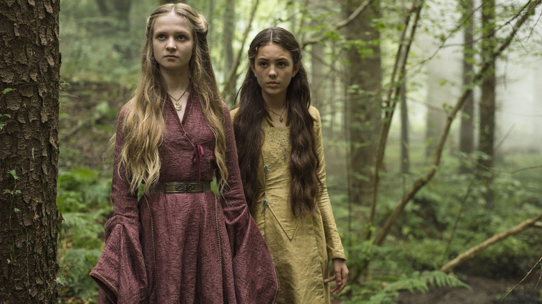 Nell Williams as young Cersei Lannister and Isabella Steinbarth as Melara Hetherspoon standing in the woods in Game of Thrones