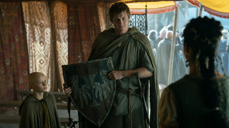 Egg standing next to Dunk (who has a shield) in A Knight of the Seven Kingdoms