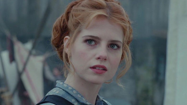 Lucy Boynton as Andrea looking off into the distance in Apostle